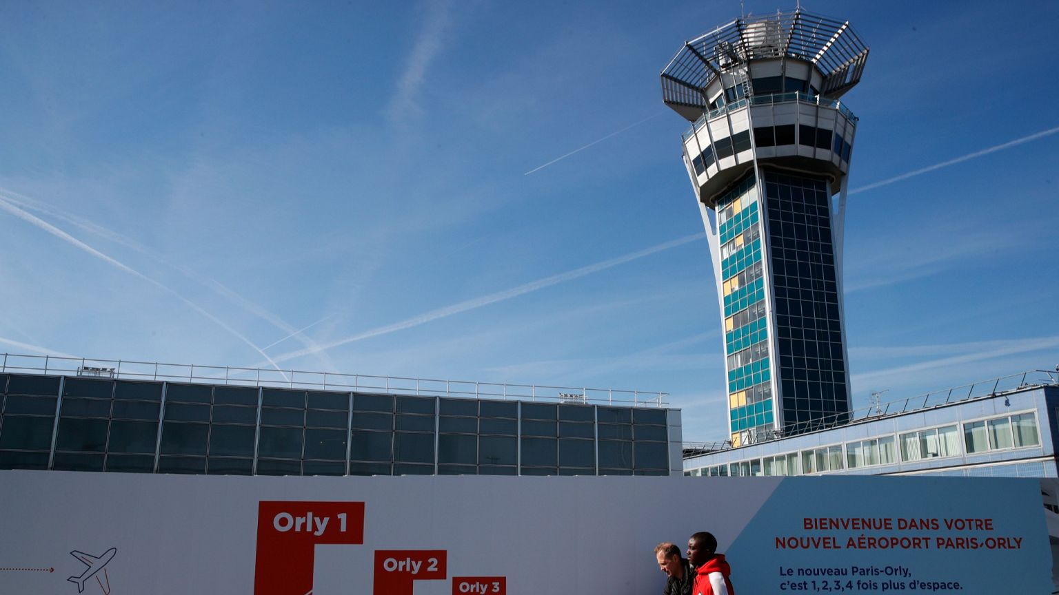 Passengers arrive at Orly airport, south of Paris.