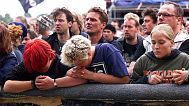 Young people grieve and pray during a memorial service held by the bishop of Roskilde, Jan Lindhardt, Saturday, July 1, 2000