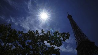 The sun shines over the the Eiffel Tower during a heat wave, Monday, June 30, 2025 in Paris