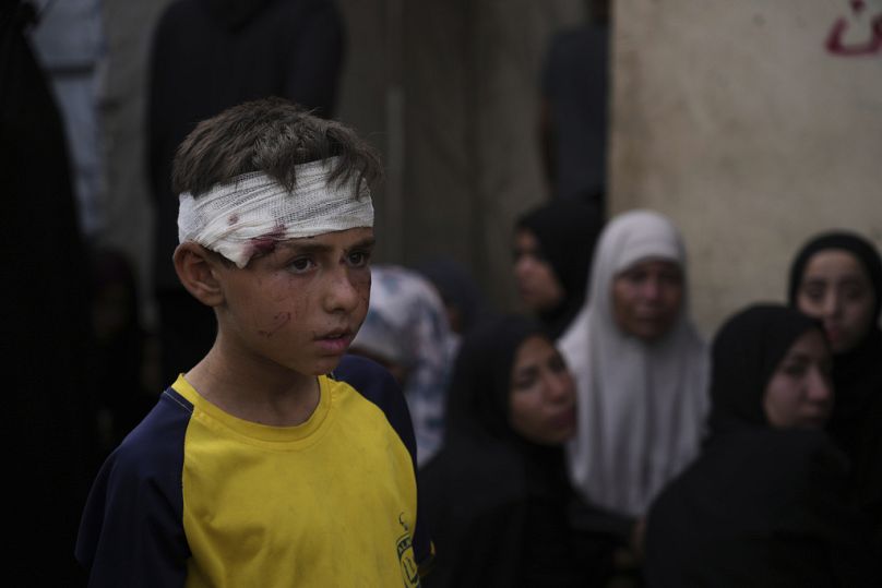 Ali Al-Aimawi attends the funeral of his relatives, who were killed in an Israeli bombardment of Al-Zawaideh, Deir al-Balah, Gaza Strip, on Tuesday, July 1, 2025