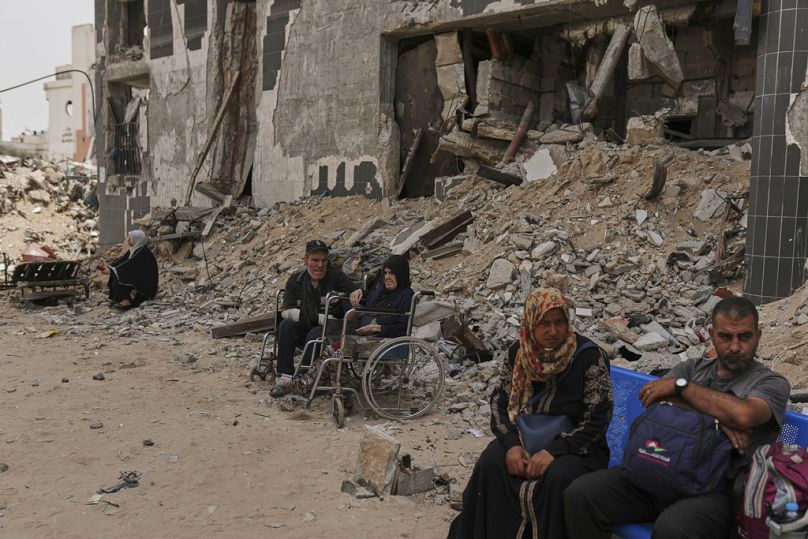 Kidney patients sit amid the destruction caused by the Israeli army at Shifa Hospital compound in Gaza City on Tuesday, July 1, 2025