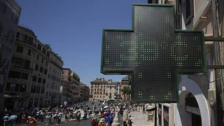 The thermometer of a drugstore shows the temperature of 39 degrees Celsius (102 degrees Fahrenheit) during a heat wave, in Rome, Tuesday, July 1, 2025. (AP Photo/Andrew Medich