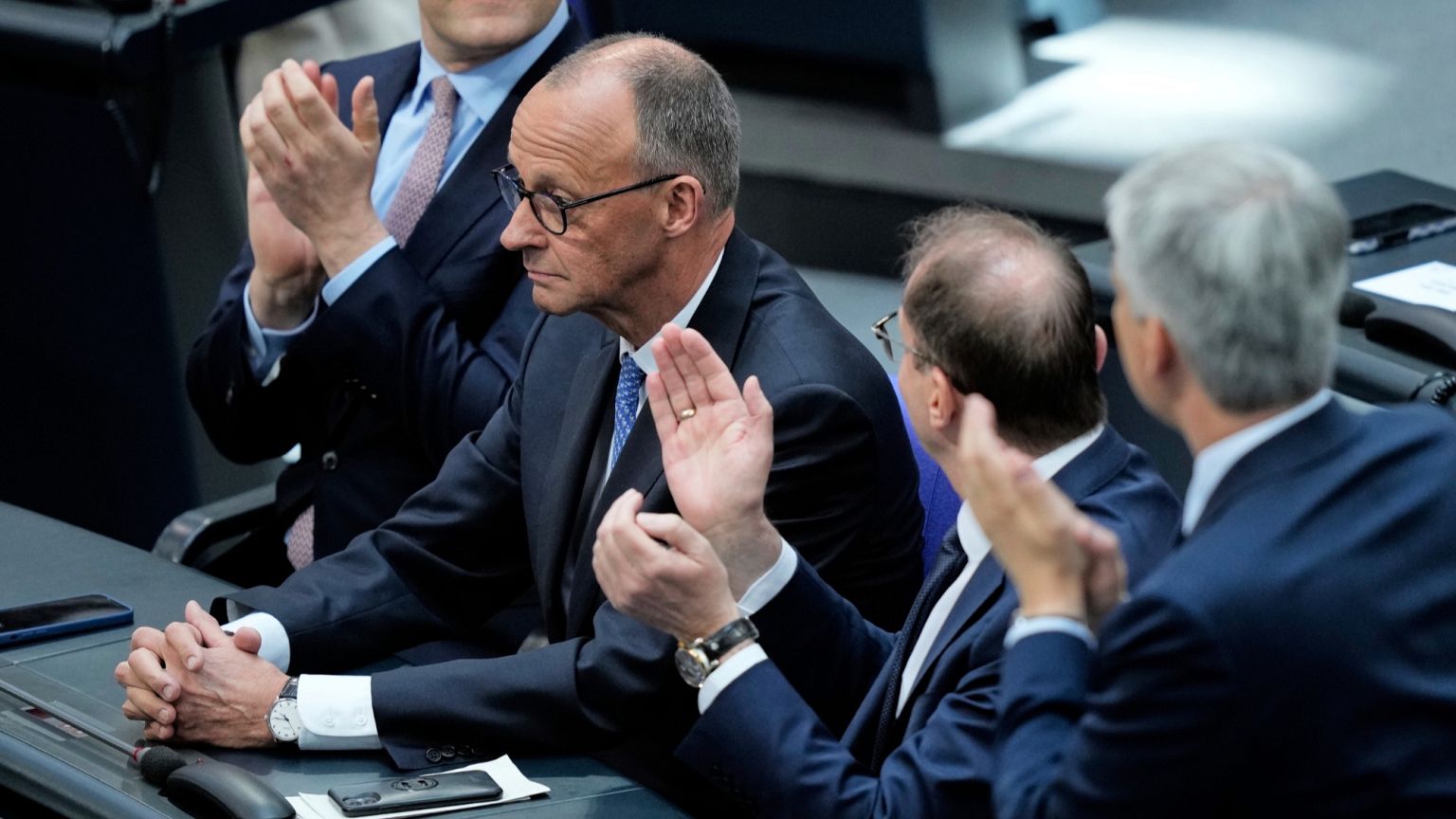 FILE: CDU leader Friedrich Merz is applauded after being elected new chancellor at the German federal parliament, Bundestag, in Berlin, 6 May 2025