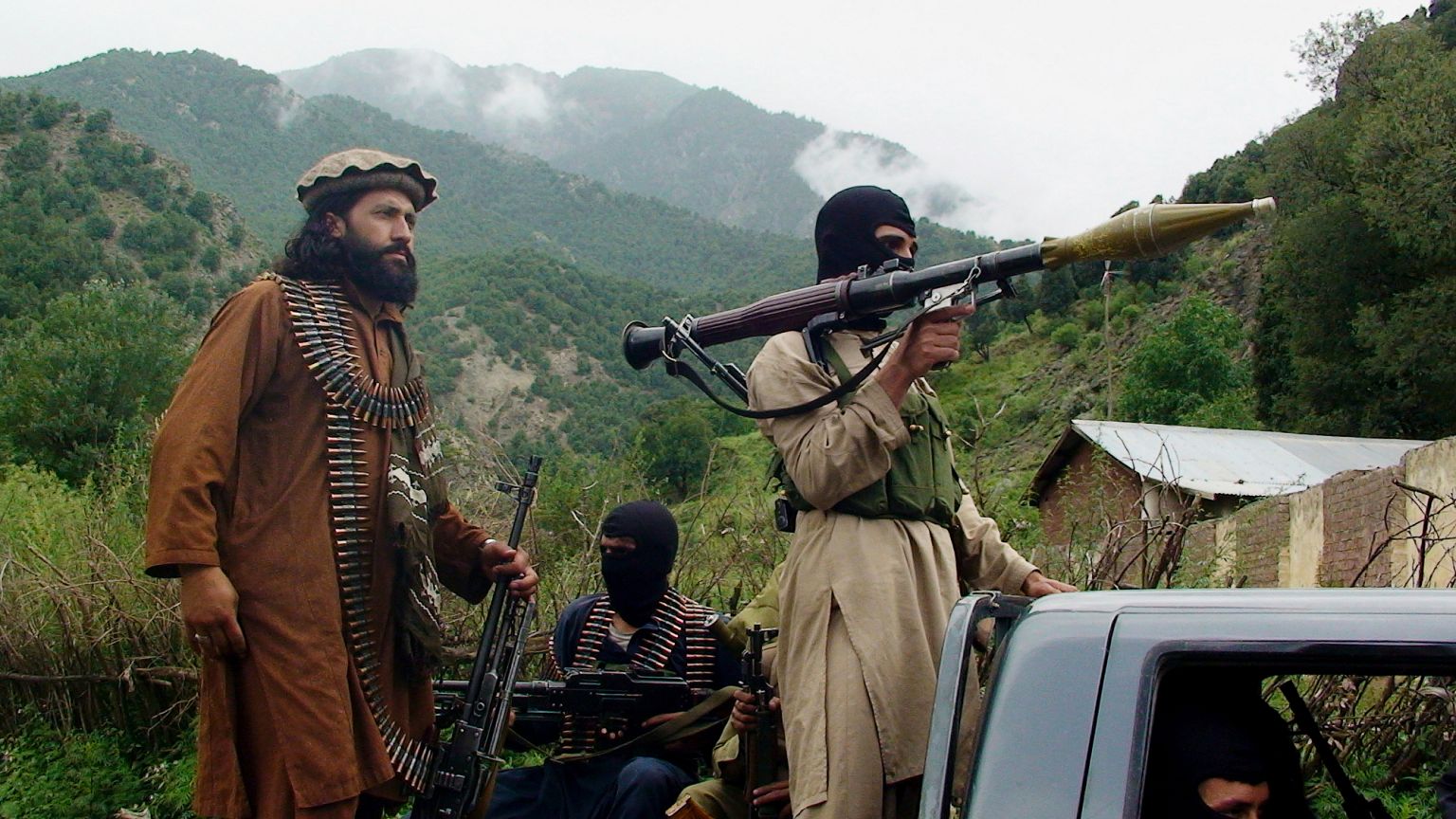 Pakistani Taliban patrol in then their stronghold of Shawal in the tribal region of South Waziristan, 5 August, 2012