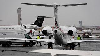 Planes are parked at a private jet terminal at Harry Reid International Airport.