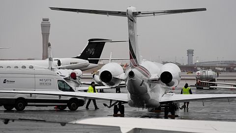 Planes are parked at a private jet terminal at Harry Reid International Airport.