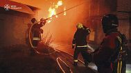 In this photo provided by the Ukrainian Emergency Service, first responders work to extinguish a fire following a Russian attack in Kyiv region, Ukraine, Friday, July 4, 2025.