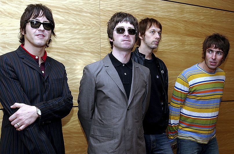 Oasis pose in Hong Kong - 25 Feb. 2006. From left: Gem Archer, Noel Gallagher, Andy Bell, and Liam Gallagher