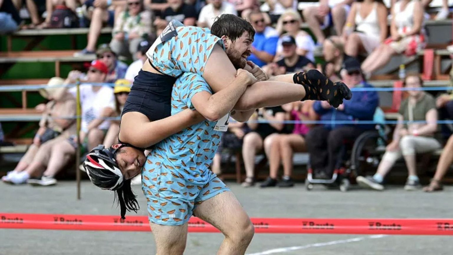 What is the Wife-Carrying World Championship in Finland? Pictured: Sweden's Viktor Okerblom Jonsson carrying Amanda Stenberg