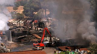 Firefighters at the scene of an explosion at a gas station in Rome, Italy, Friday, July 4, 2025.