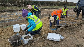 Historic England and community volunteers in trenches on the Willersey dig. 