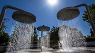 Children cool off on a hot day in a public fountain in Vilnius, 3 July, 2025