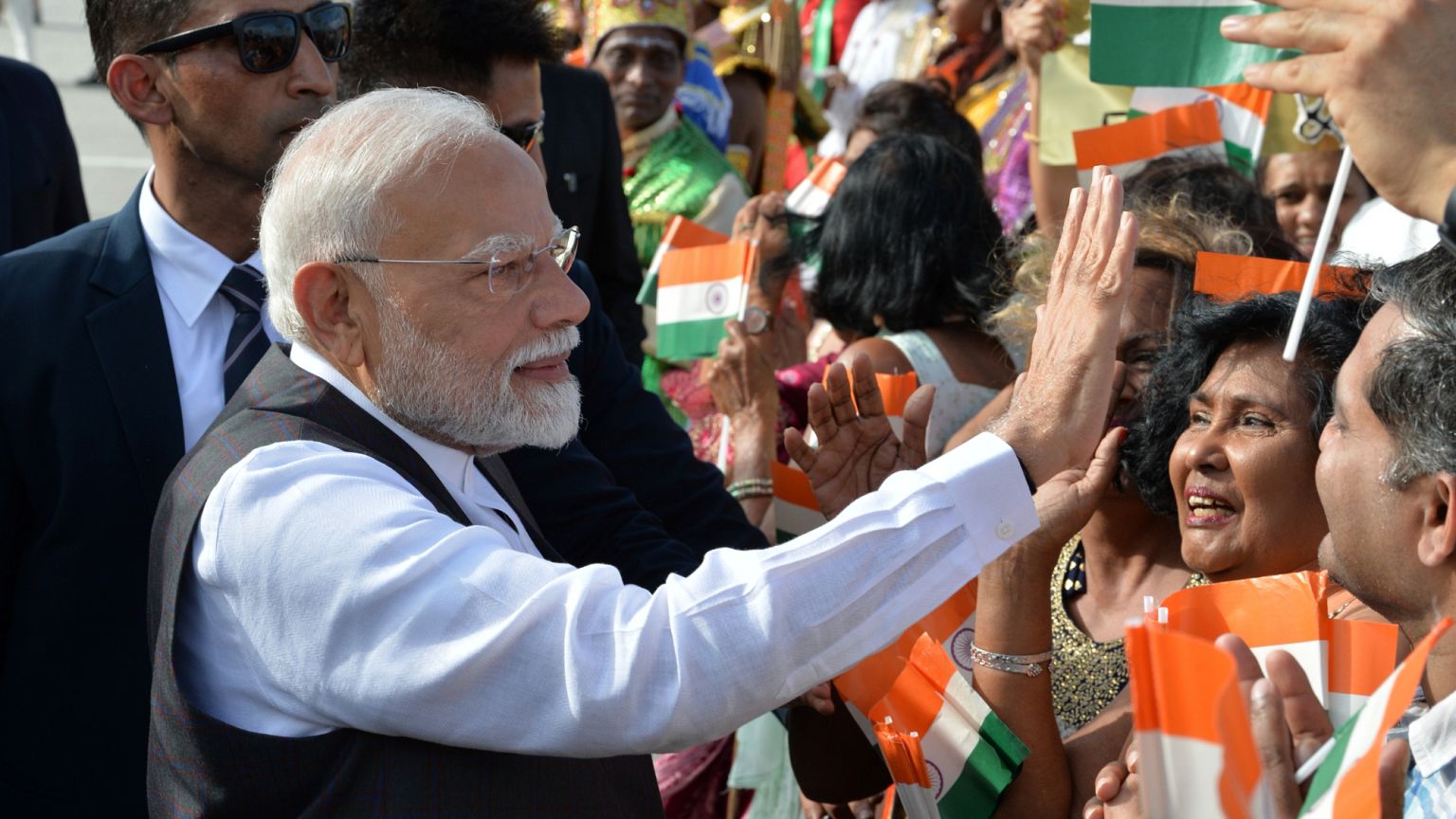 Indian Prime Minister Narendra Modi greets people upon arriving at Piarco International Airport in Piarco, 3 July, 2025