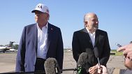 President Donald Trump listens as Commerce Secretary Howard Lutnick speaks with reporters. Morristown Municipal Airport, New Jersey. 6 July 2025.