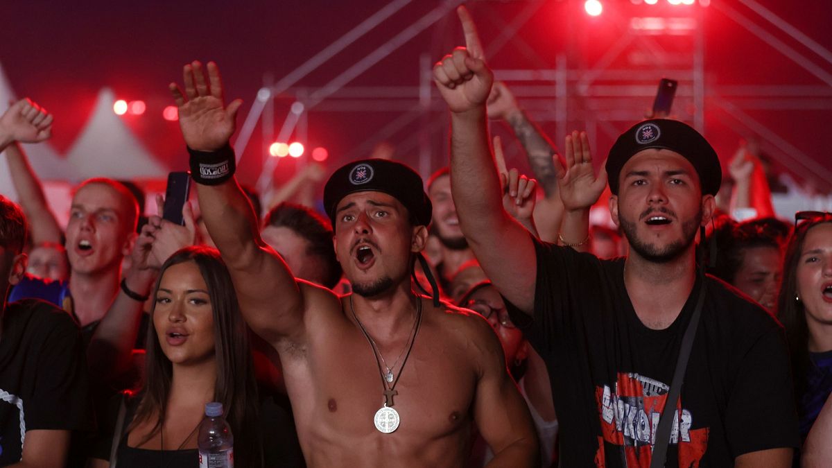 Croatian right-wing singer Marko Perković and fans make pro-Nazi salutes at record-breaking concert