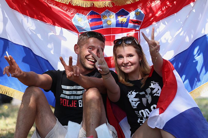 Fans pose prior to the concert of right-wing singer Marko Perković