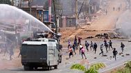 Police use water cannons to disperse protesters during the 1990 "Saba Saba" democracy protests in Nairobi's Kangemi slum, Kenya, on July 7, 2025.