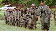 FILE - A group of armed Kurdish fighters from the Kurdistan Workers Party (PKK) enter northern Iraq, 14 May 2013.