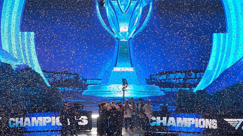 Team T1 celebrates after defeating Weibo Gaming to win the 2023 League of Legends World Championship in Seoul on 19 November. 
