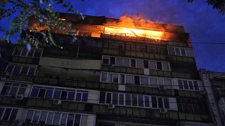 A fire burns at a residential building after a Russian attack in Kyiv, Ukraine, early Thursday, July 10, 2025.