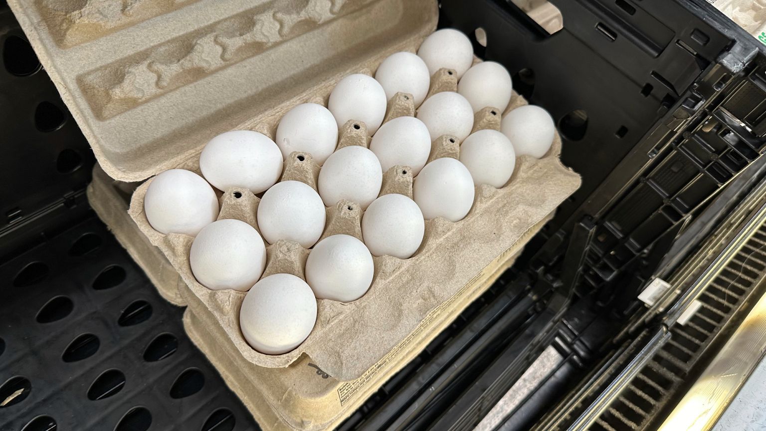 A carton of eggs sits open on the shelf in a refrigerated display case in a Walmart store. Colorado. 5 May 2025.