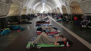 People rest in a metro station, being used as a bomb shelter, during a Russian attack in Kyiv, Ukraine, early Thursday, July 10, 2025.