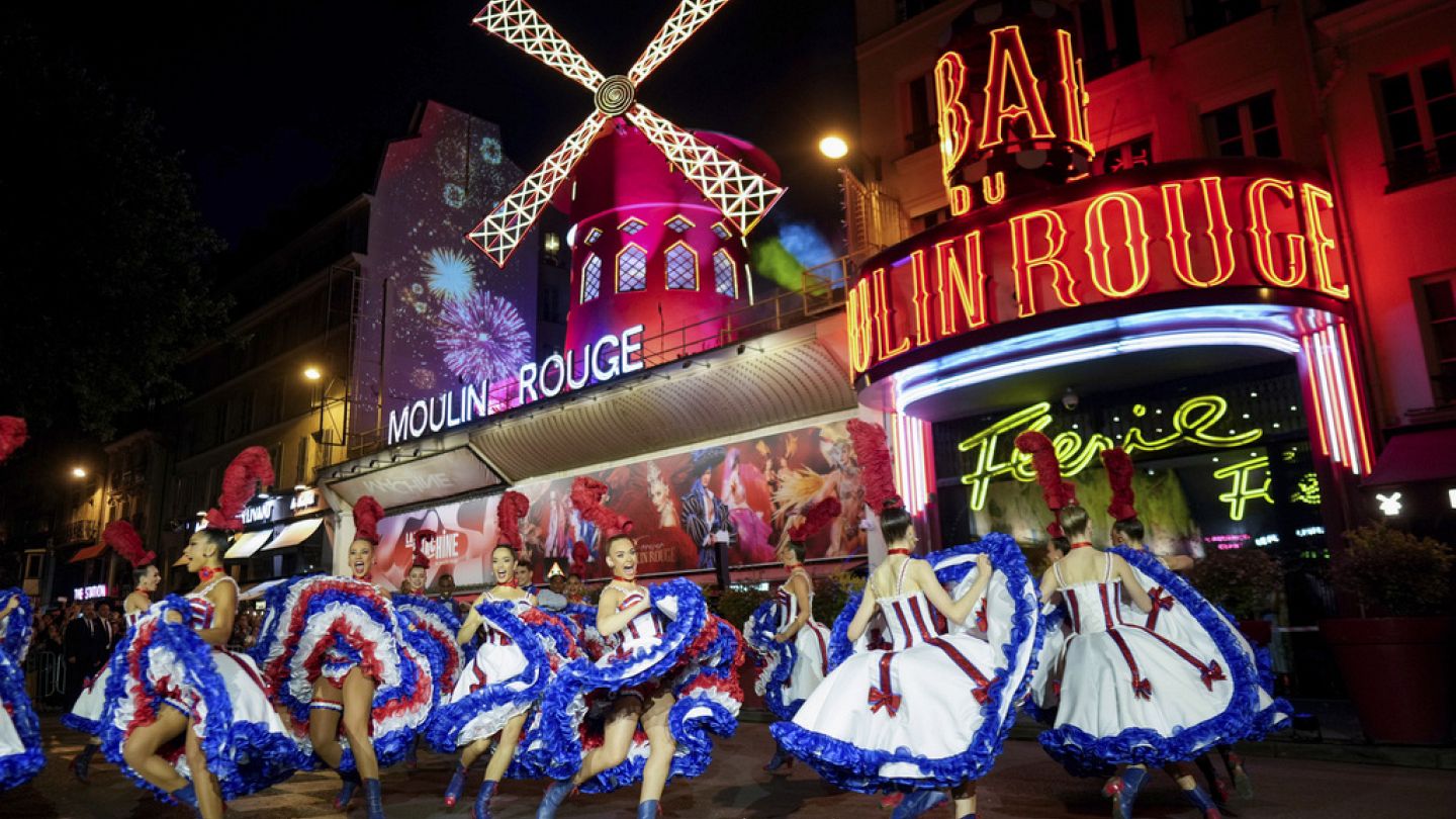 Moulin Rouge celebrates as blades of famous windmill turn again
