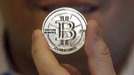 In this April 3, 2013 photo, a 25 Bitcoin token is displayed in Sandy, Utah. 
