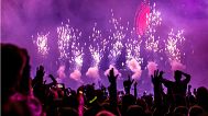 Revellers enjoy a DJ and fireworks