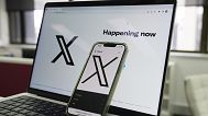 The X application seen on a phone and computer.