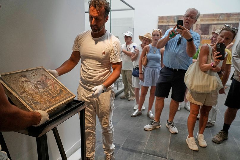 Restorers set on display the Roman mosaic