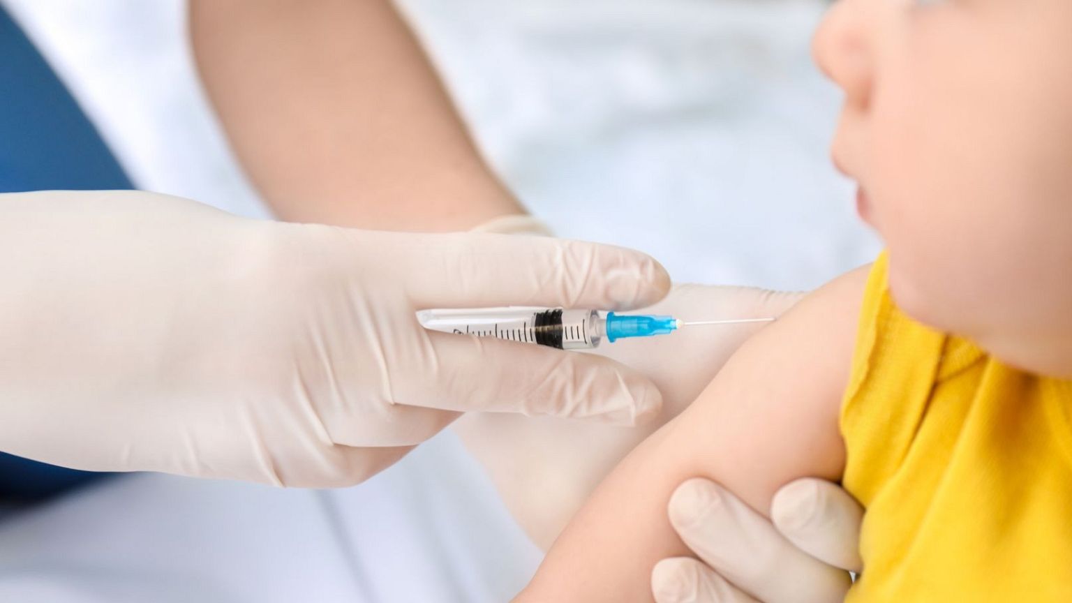 A baby receives a vaccine.