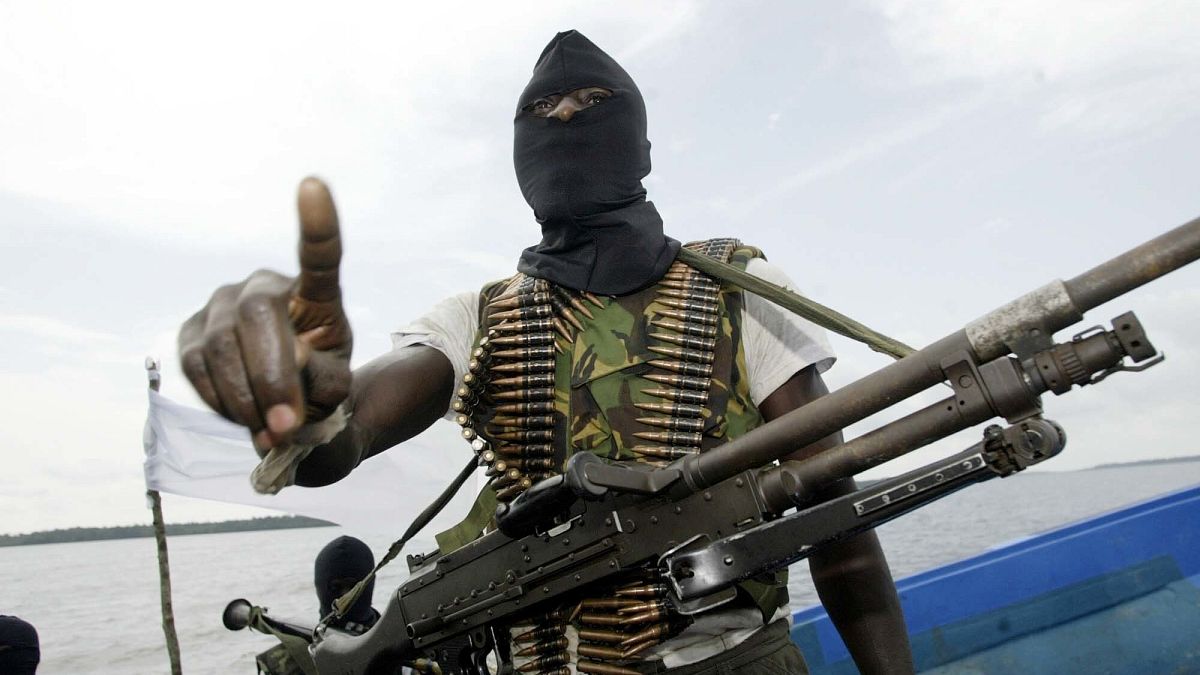 Unknown gunmen kill at least 20 people in an attack in central Nigeria, officials say