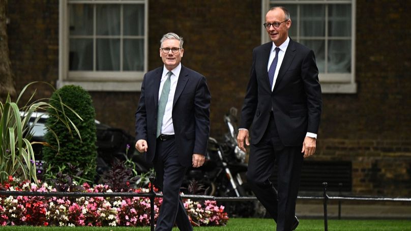 German Chancellor Friedrich Merz, right walks with Britain's Prime Minister Keir Starmer ahead of their meeting at 10 Downing Street in London, Thursday, July 17, 2025.