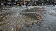 A motorcyclist rides through a flooded road following heavy monsoon rains in Rawalpindi, 17 July, 2025