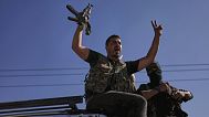 Bedouin fighter flashes victory sign and shouts slogans at Mazraa village in Sweida outskirts, during clashes between Bedouin clans, Druze militias, Syria, July 18, 2025