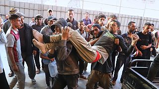 A Palestinian man, injured at a food distribution point run by the GHF, a US-backed org approved by Israel, is being carried into Nasser Hospital in Khan Younis, July 19, 2025