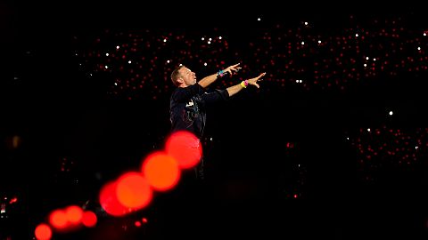 Chris Martin of Coldplay performs during the band's Music Of The Spheres World Tour at D. Y. Patil Sports Stadium in Navi Mumbai, Saturday, Jan. 18, 2025.