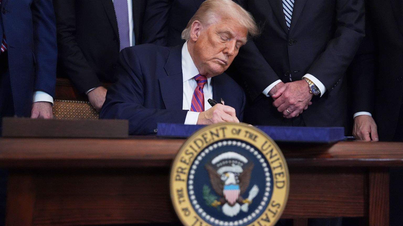 Trump signs the GENIUS Act, a bill regulating stable currencies, in the East Room of the White House on 18 July 2025 in Washington.