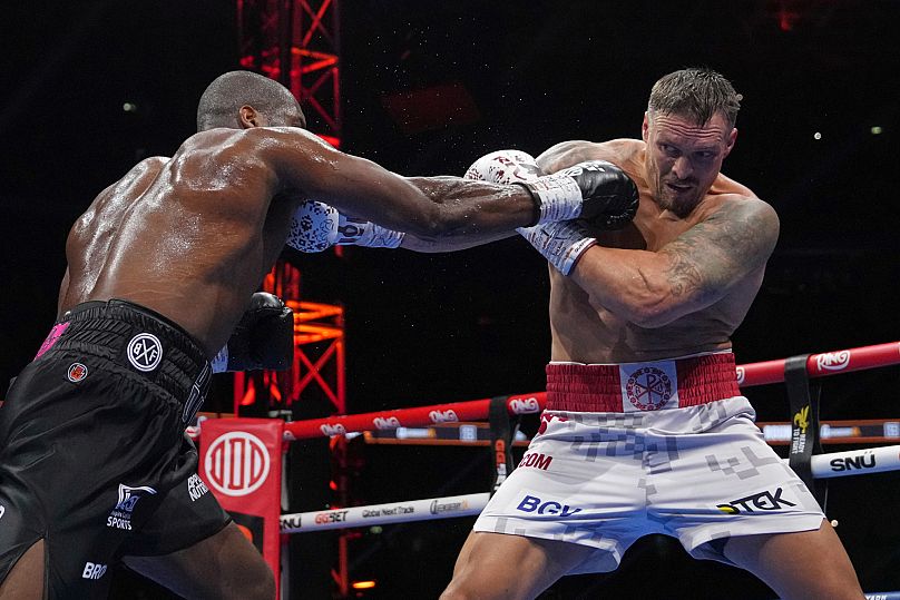 Ukraine's Oleksandr Usyk, right, and Britain's Daniel Dubois in action during the undisputed world heavyweight boxing title fight in London, Saturday, July 19, 2025.