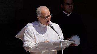 Pope Leo XIV blesses the faithful gathered in the square in front of the Apostolic Palace for the noon Angelus prayer in Castel Gandolfo, Italy, Sunday, July 20, 2025.