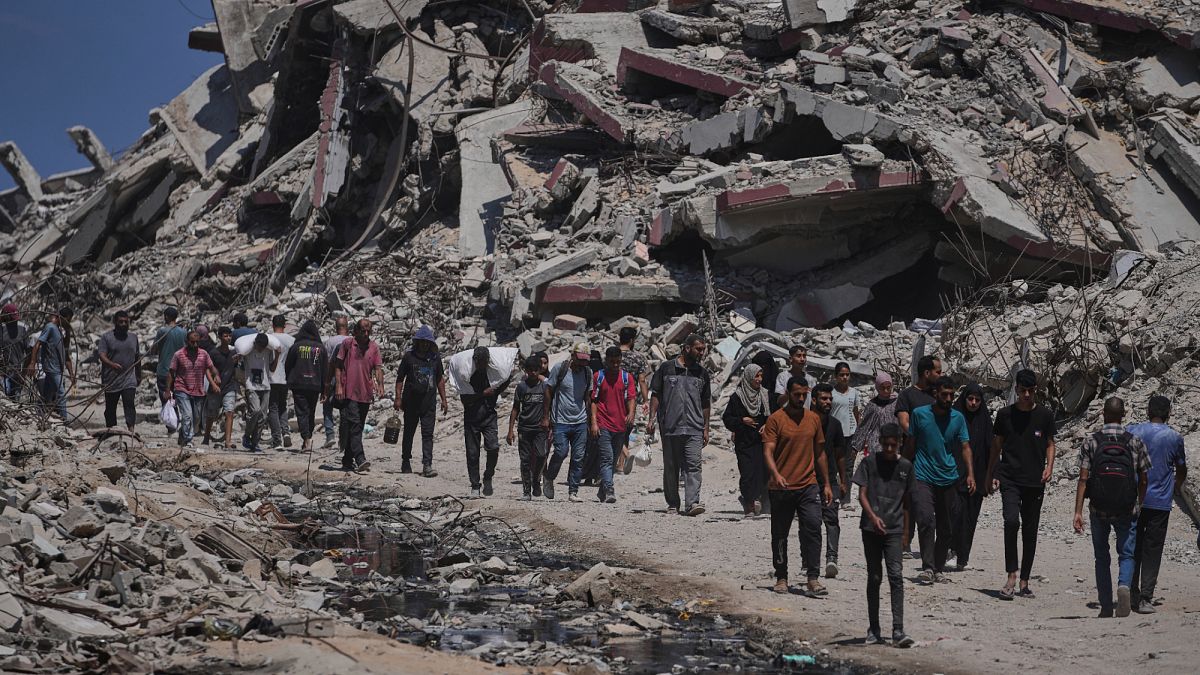 Officials say 85 Palestinians seeking aid are killed in Gaza as Israel widens evacuation orders