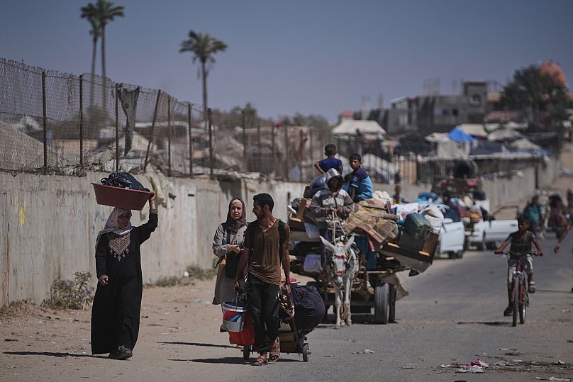 Palestinians flee Deir al-Balah after the Israeli military issued evacuation orders ahead of expected operations in the area, 20 July, 2025