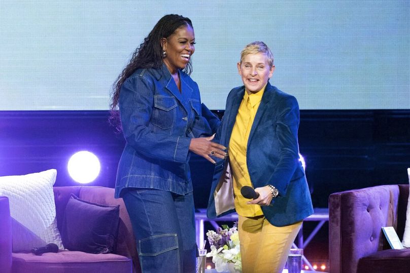 Former first lady Michelle Obama greets Ellen DeGeneres on stage as she launches her new book “The Light We Carry: Overcoming in Uncertain Times”