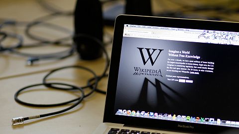 A blackout landing page is displayed on a laptop computer screen inside the "Anti-Sopa War Room" at the offices of the Wikipedia Foundation in 2012. 
