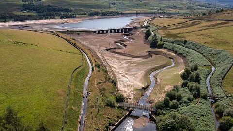 FILE - Traffic crosses a bridge at Woodhead Reservoir in West Yorkshire, England, Monday, July 18, 2022