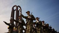 Military students march by the Unknown Soldier monument after a swearing in ceremony on the Romanian Army Day in Bucharest, 25 October, 2023