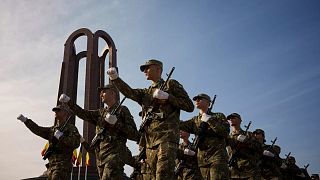 Military students march by the Unknown Soldier monument after a swearing in ceremony on the Romanian Army Day in Bucharest, 25 October, 2023