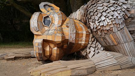 Giant trolls made from trash warn against environmental destruction