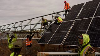 Workers install panels at a solar project  in Galena, Alaska.